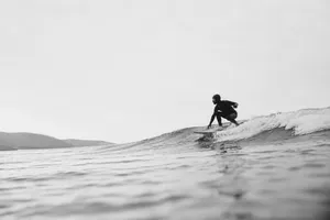Surfing the calm, overcast waves