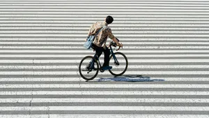Urban Cyclist Crossing the Street