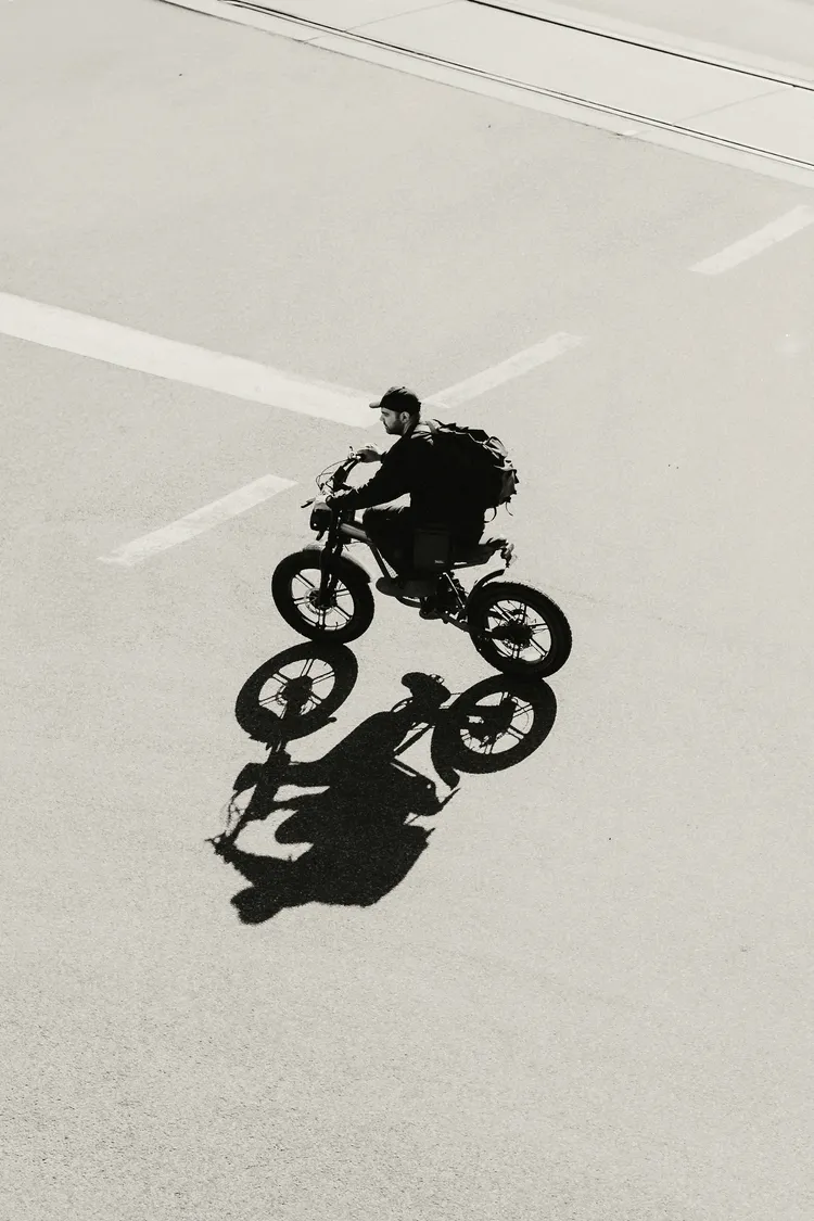 Rider crossing an empty street